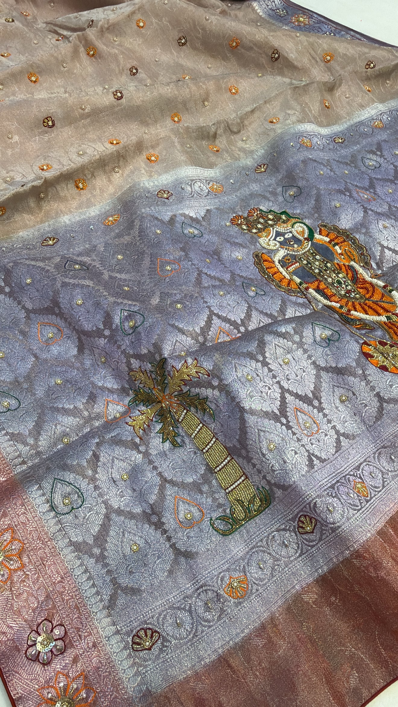 Dusty lilac tissue brocade shreenathji motif hand embroidered kadhwa saree